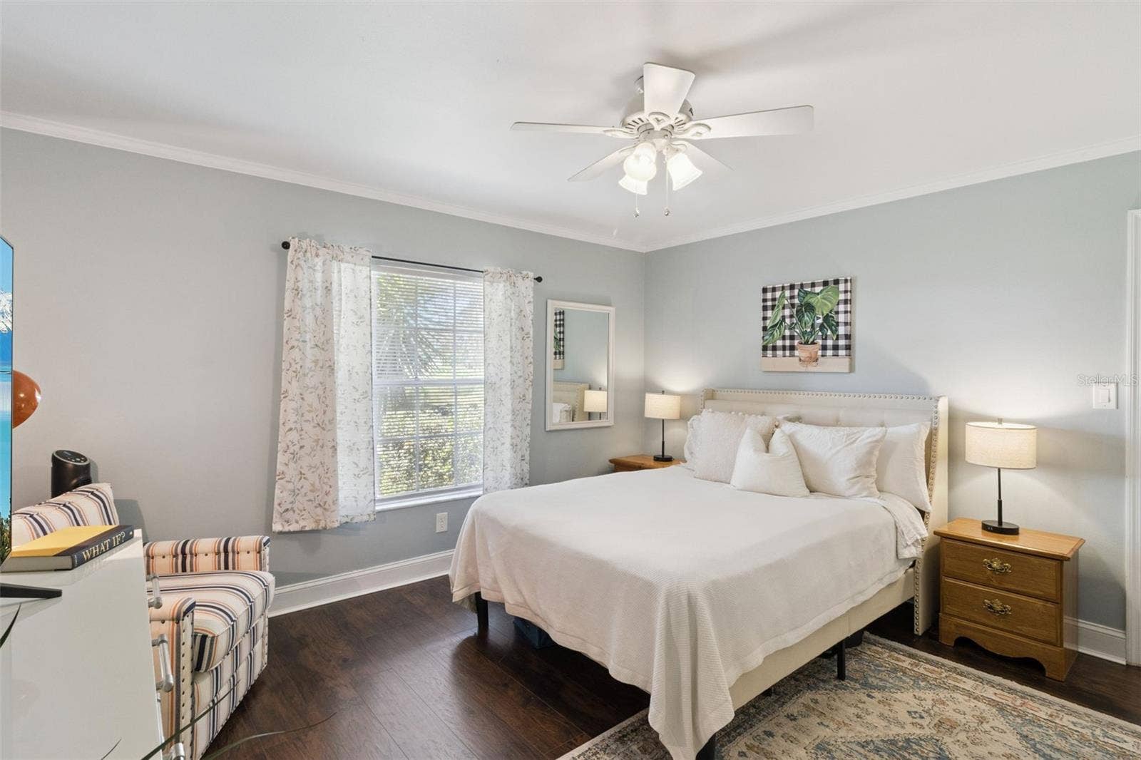 1066 VILLA LANE, #63, Apopka, FL 32712 Crown molding and ceiling fan with lights plus no carpet are in the primary bedroom retreat.