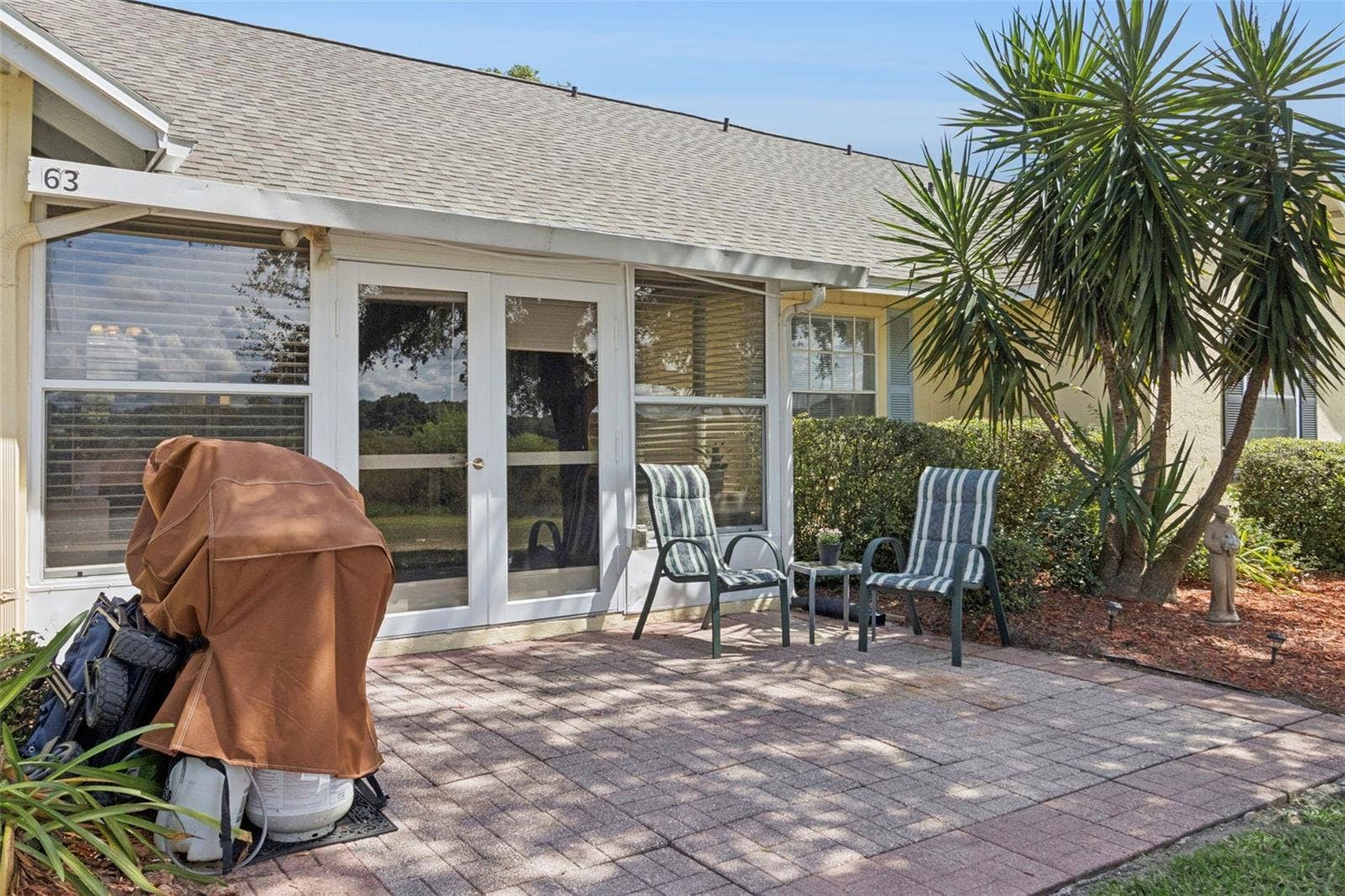 1066 VILLA LANE, #63, Apopka, FL 32712 Fabulous Florida foliage flanks the oversized paver patio.