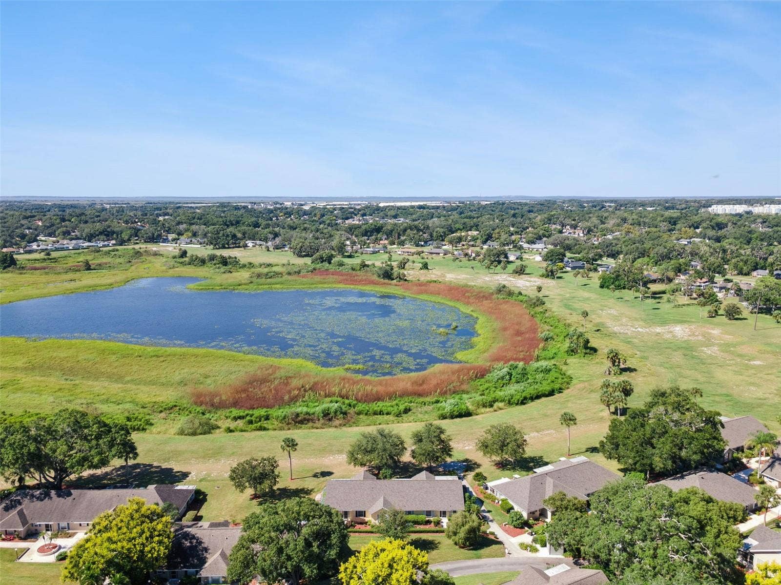 1066 VILLA LANE, #63, Apopka, FL 32712 A move-in ready, lake-view home with front-row Florida sunsets.