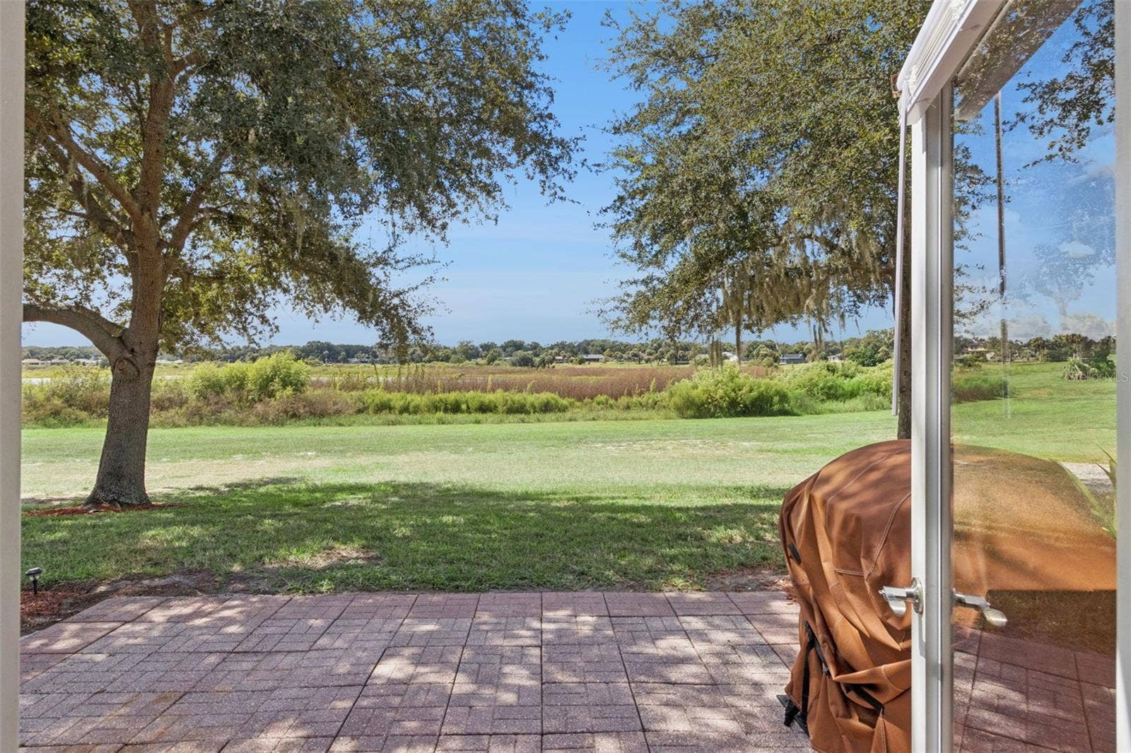 1066 VILLA LANE, #63, Apopka, FL 32712 From your spacious paver patio, watch the glorious sunsets unfold over large Lake Alden.