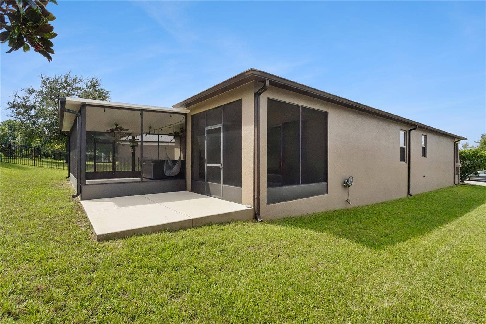 30022 DONNINGTON LOOP, Mount Dora, FL 32757 Back open patio area, ideal for a BBQ grill