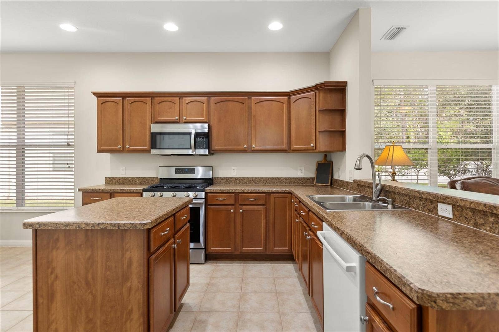 4711 HERITAGE TRAIL, Leesburg, FL 34748 Spacious Kitchen with Center Island and Ample Cabinetry