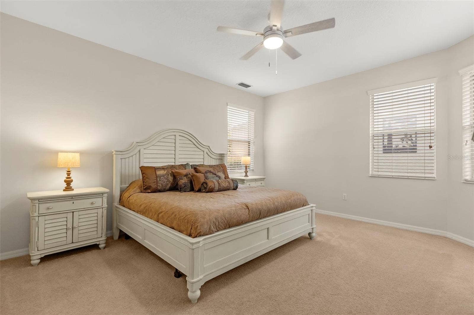 4711 HERITAGE TRAIL, Leesburg, FL 34748 Spacious Primary Bedroom with Abundant Natural Light