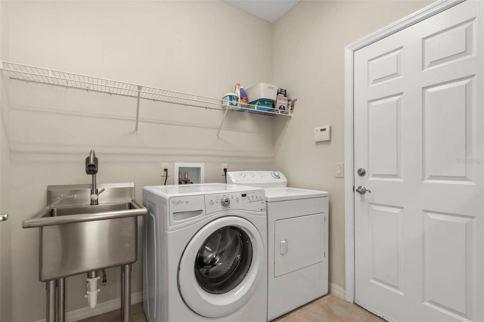 4711 HERITAGE TRAIL, Leesburg, FL 34748 Laundry Room with Utility Sink and Storage