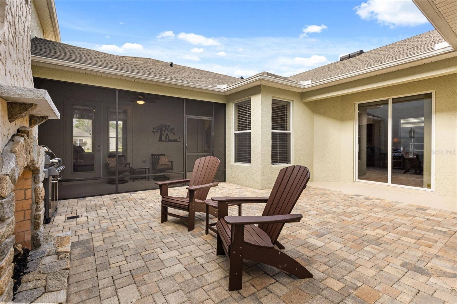 4711 HERITAGE TRAIL, Leesburg, FL 34748 Private Paver Courtyard with Gas Fireplace and Screened Lanai