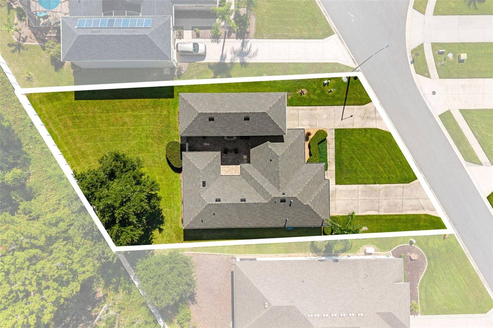 4711 HERITAGE TRAIL, Leesburg, FL 34748 Aerial View Highlighting Spacious homesite and RV Garage