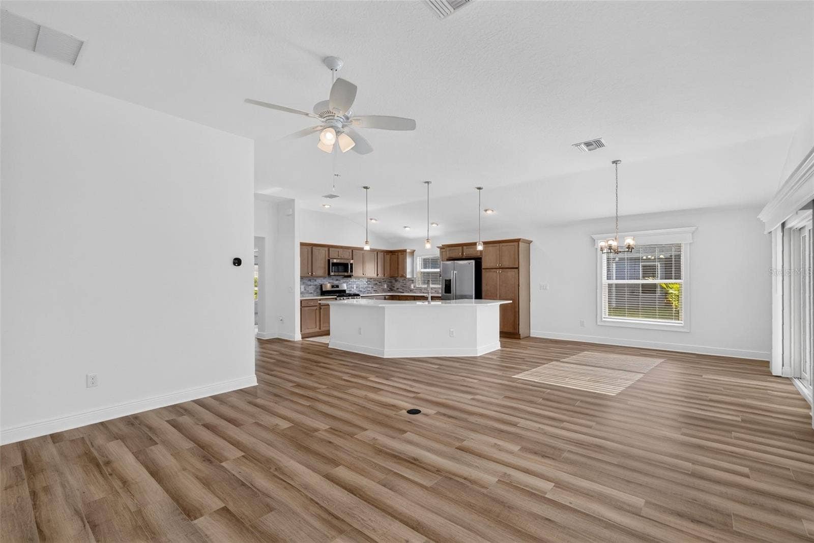 6996 DWIGHT DRIVE, The Villages, FL 34762 Living, Dining, and Kitchen