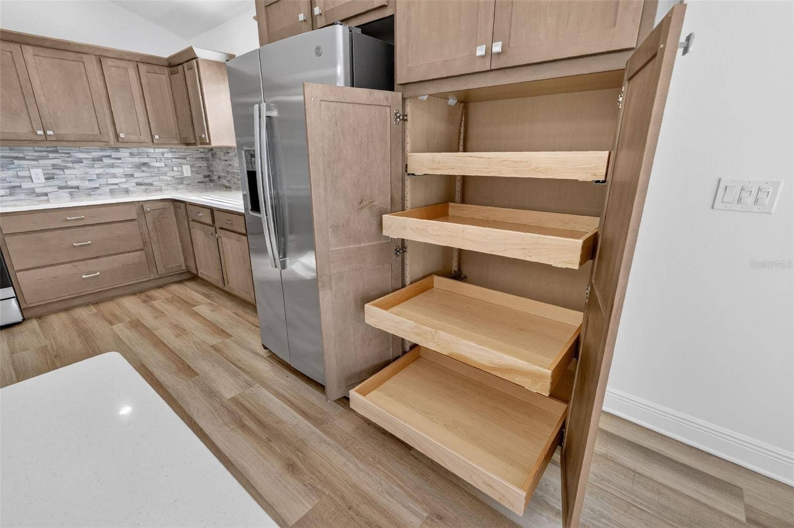 6996 DWIGHT DRIVE, The Villages, FL 34762 Kitchen Built-In Double Pantry with Roll-Out Shelving