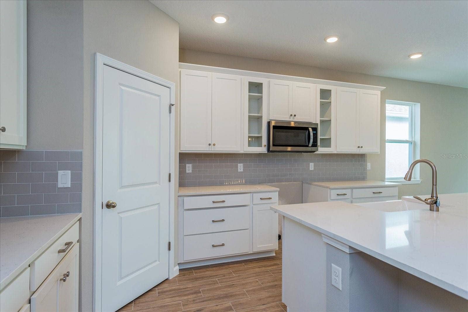 13326 PEACEFUL MELODY DRIVE, Winter Garden, FL 34787 Note: The sample photos included are of the model home and are meant to showcase the craftsmanship and design quality.