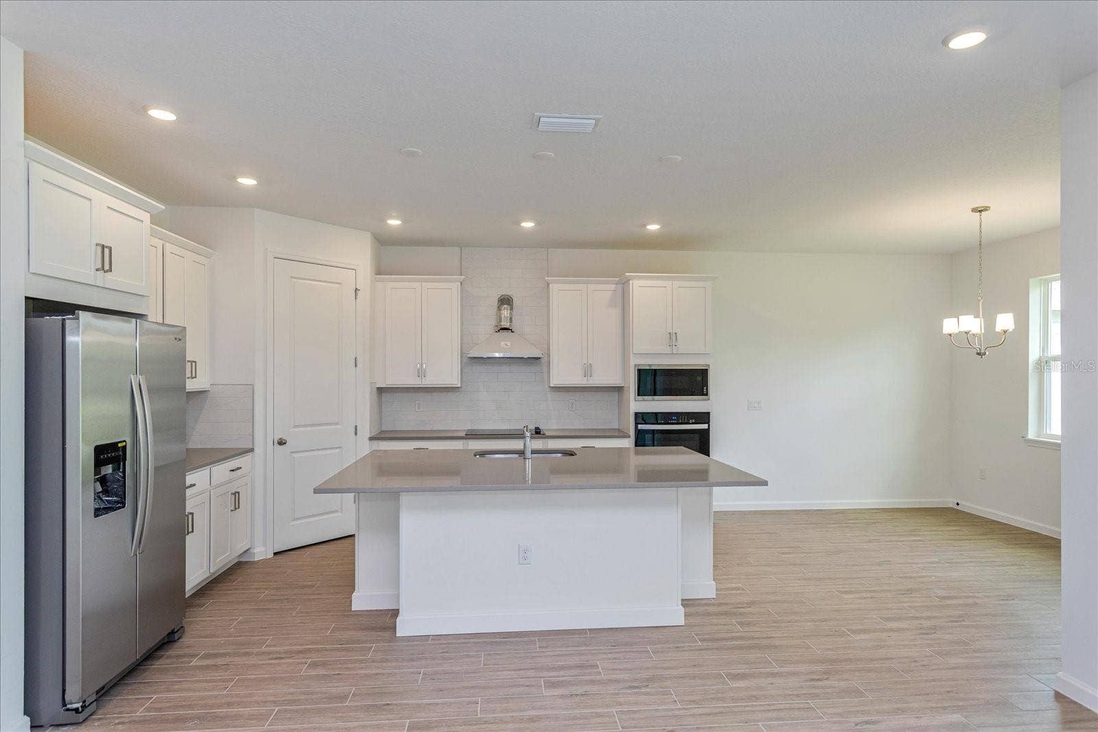 13344 PEACEFUL MELODY DRIVE, Winter Garden, FL 34787 Note: The sample photos included are of the model home and are meant to showcase the craftsmanship and design quality.