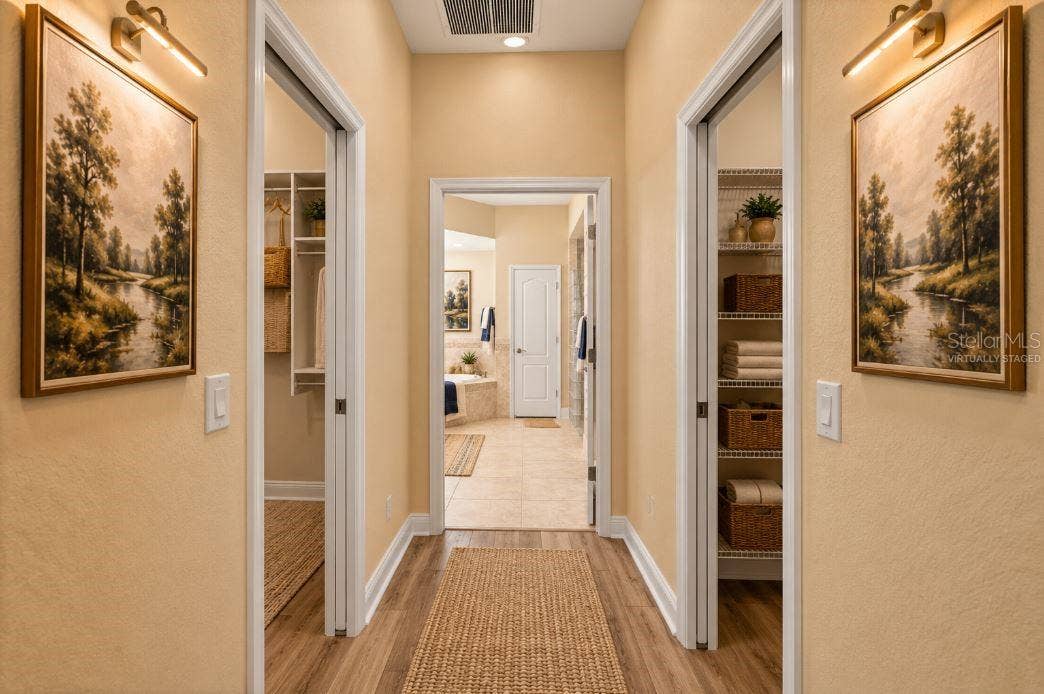Virtually staged hallway master closets.
