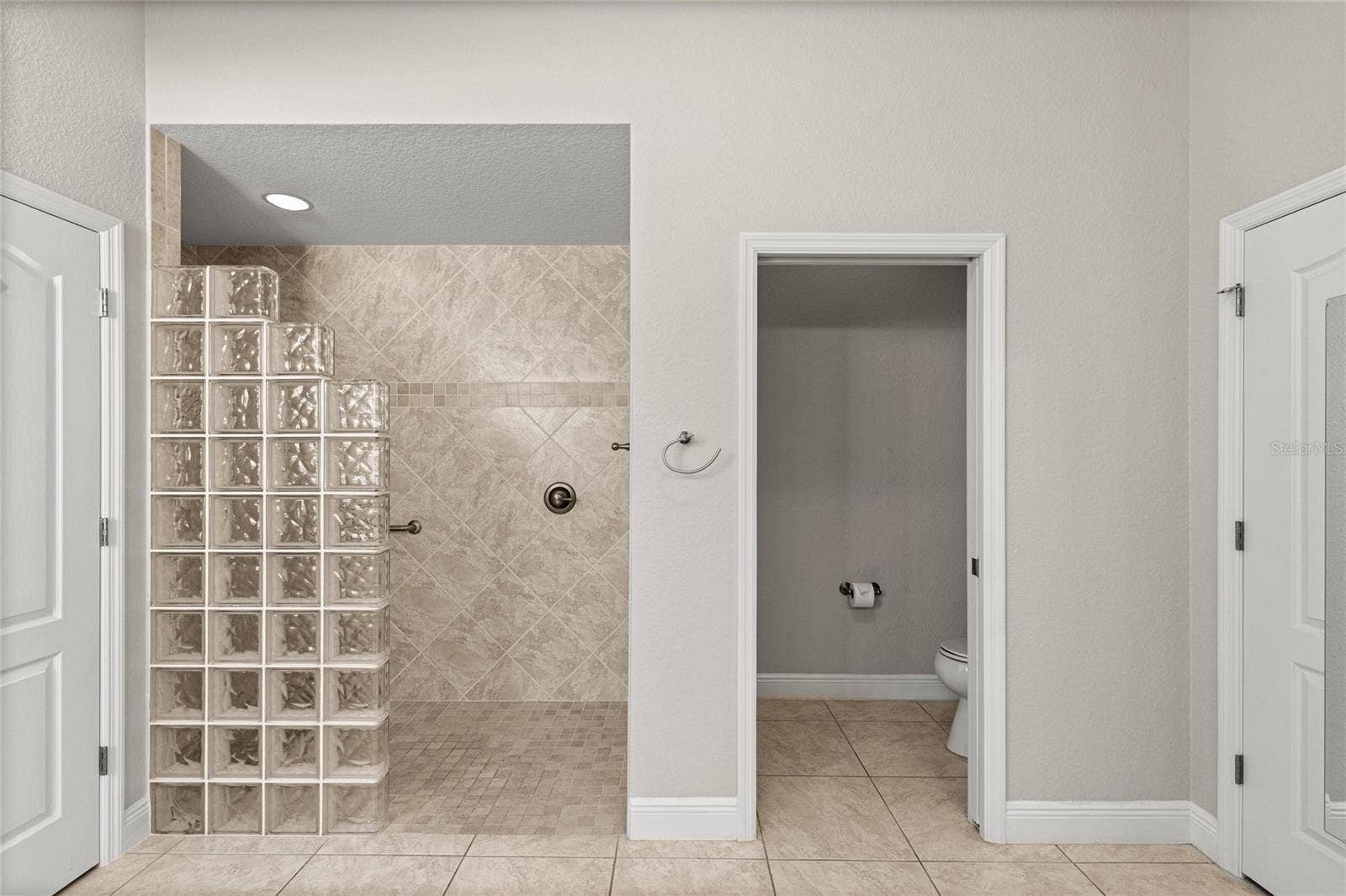 Spacious Roman Walk-In Shower.