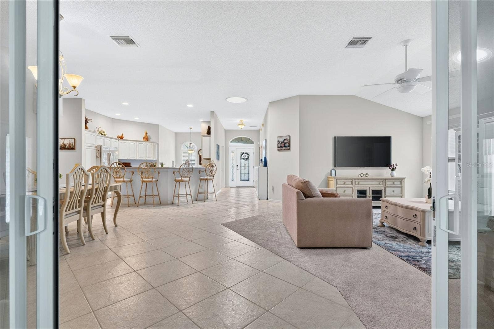 9245 SE 169TH BENTLEY STREET, The Villages, FL 32162 ENCLOSED LANAI INTO THE LIVING ROOM