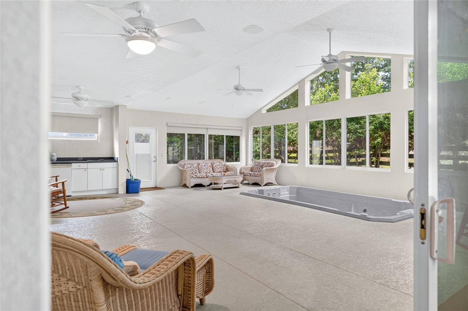 9245 SE 169TH BENTLEY STREET, The Villages, FL 32162 PRIMARY BEDROOM TO THE ENCLOSED LANAI