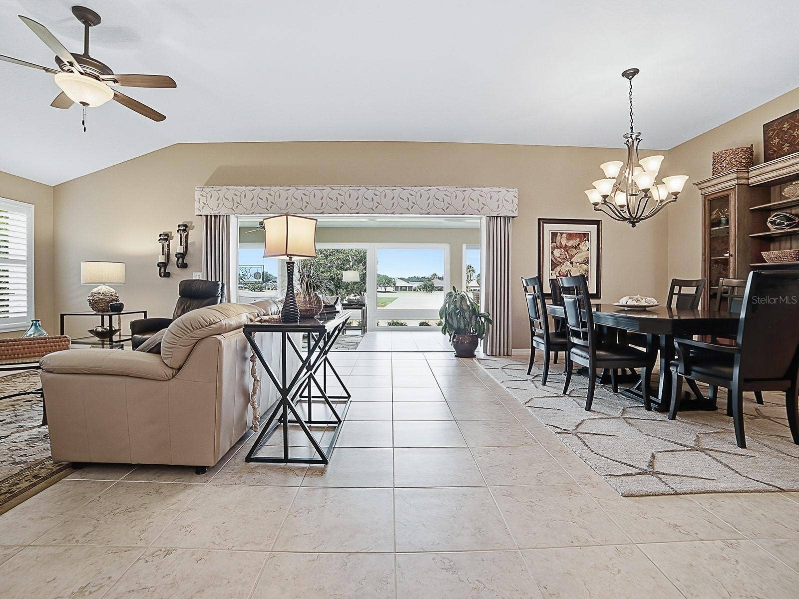 2269 KINCORD COURT, The Villages, FL 32162 Living room looking toward back of house and golf and water views