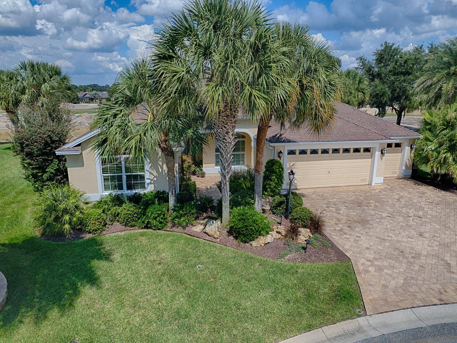 2269 KINCORD COURT, The Villages, FL 32162 Front of home , peek at golf course and ponds behind it