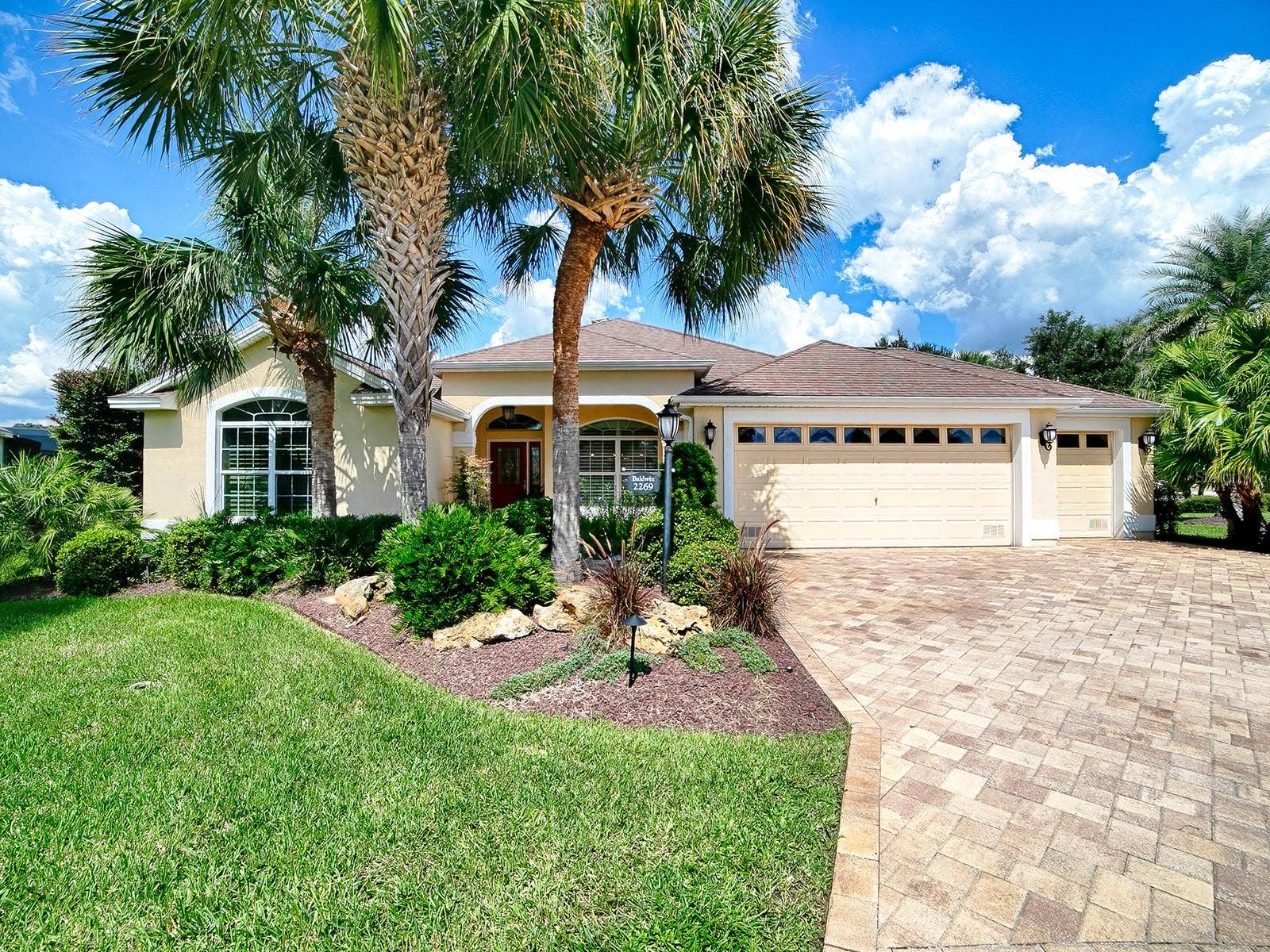 2269 KINCORD COURT, The Villages, FL 32162 Front of Home, Beautiful palms on all sides of this home, golf and pond view in back