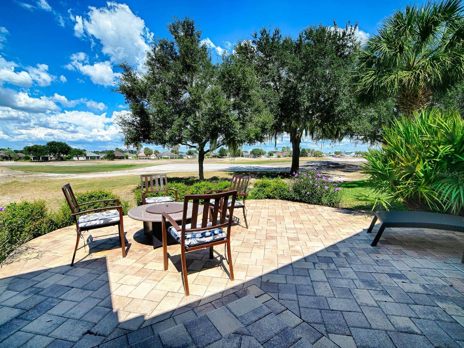 2269 KINCORD COURT, The Villages, FL 32162 Back porch Fire Pit area, overlooking golf course which is currently being totally remodeled