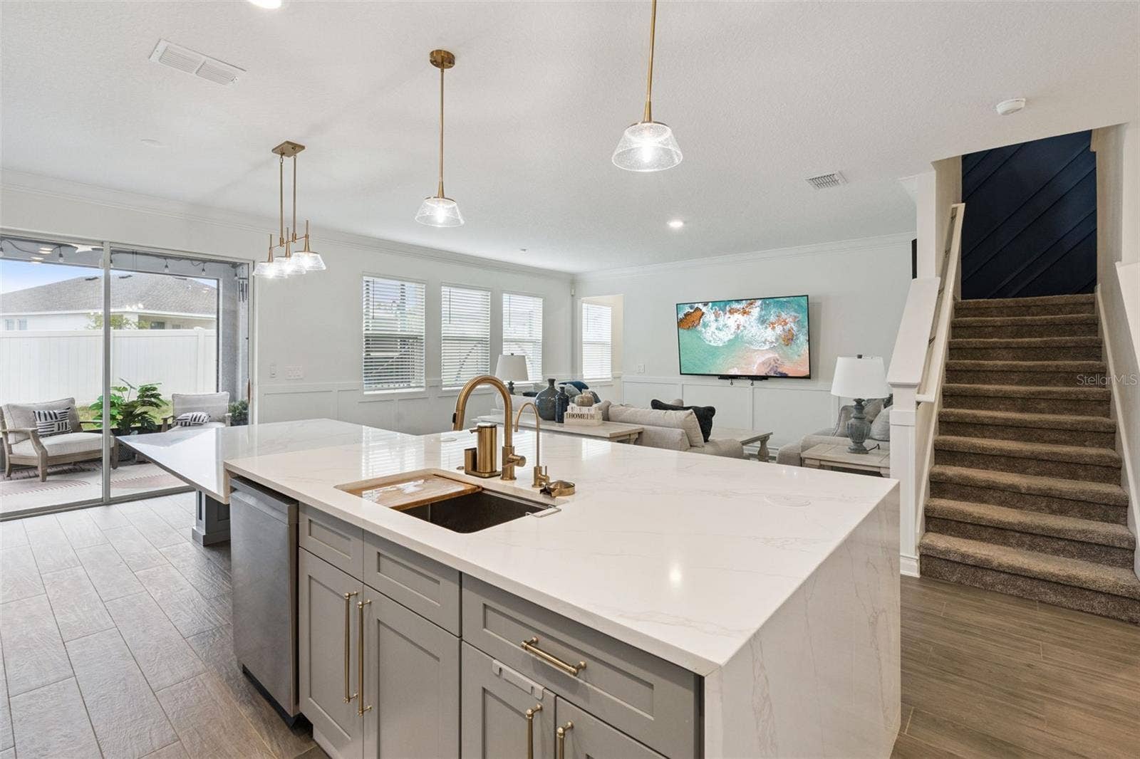 6175 SHAVASANA RD ROAD, Clermont, FL 34714 Stairs offers a landing before proceeding to second floor