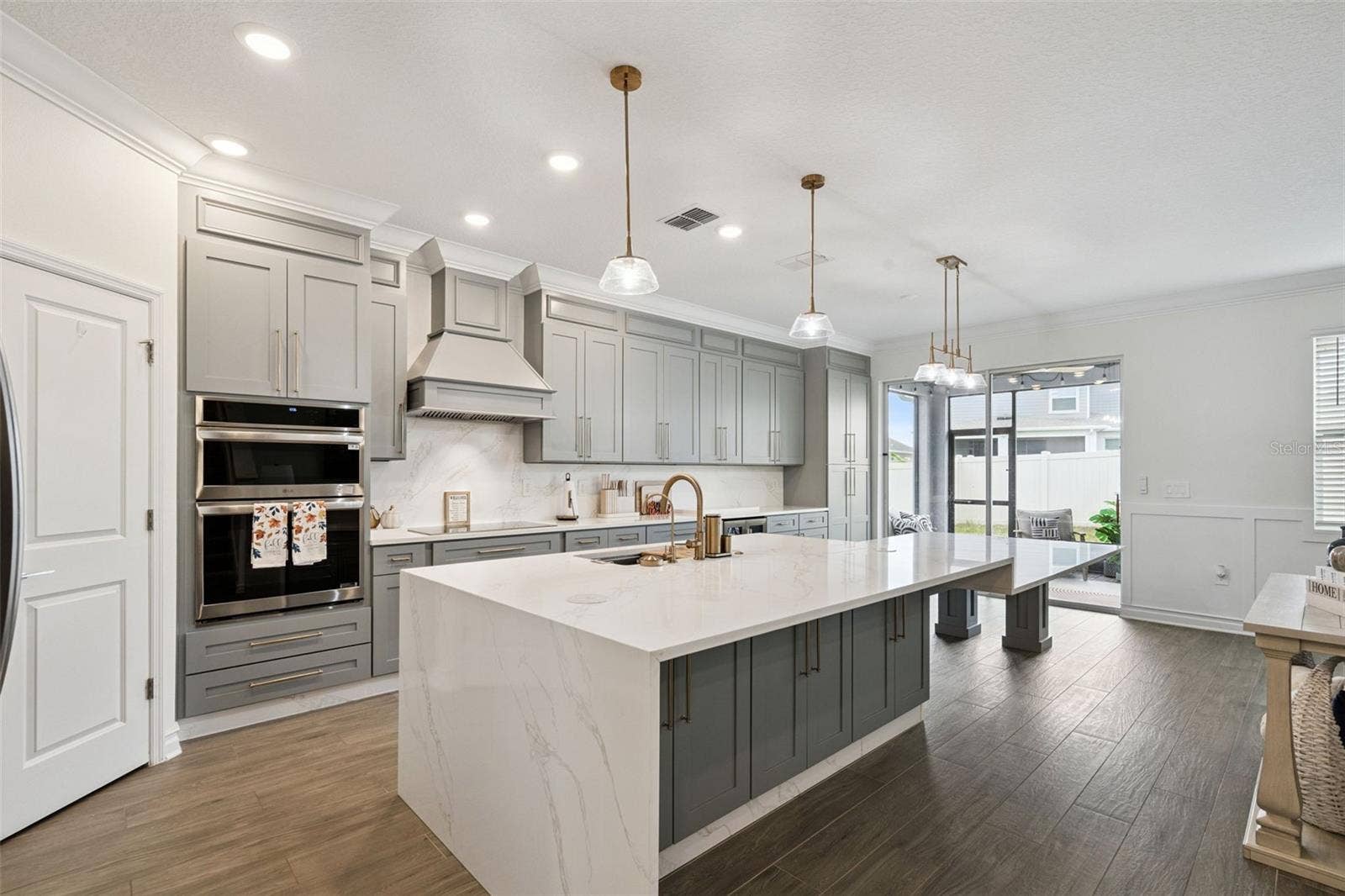 6175 SHAVASANA RD ROAD, Clermont, FL 34714 Beautiful UPGRADED wood look ceramic tile flooring throught the first floor