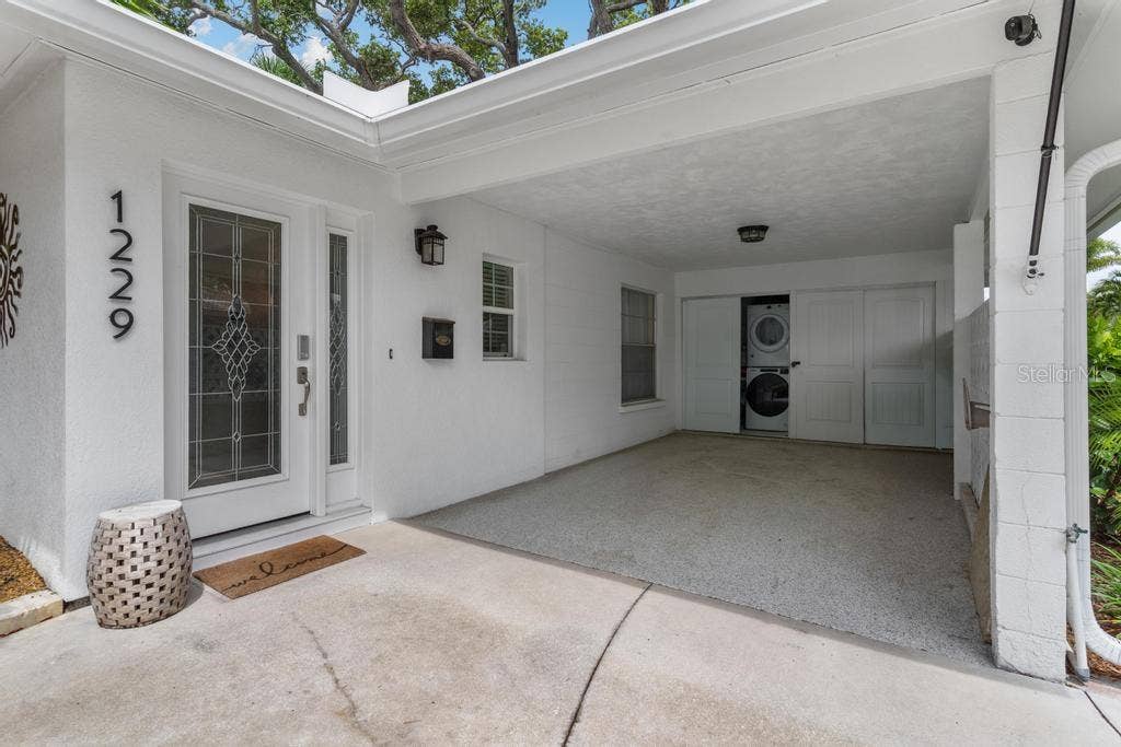 1229 MOONMIST CIRCLE, #P6, Sarasota, FL 34242 Laundry and Storage Area within the Carport