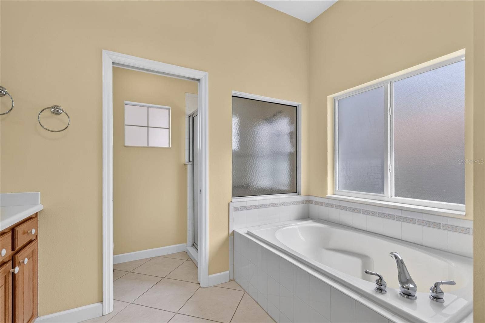 Frosted windows in tub and shower areas allow light while keeping your privacy.
