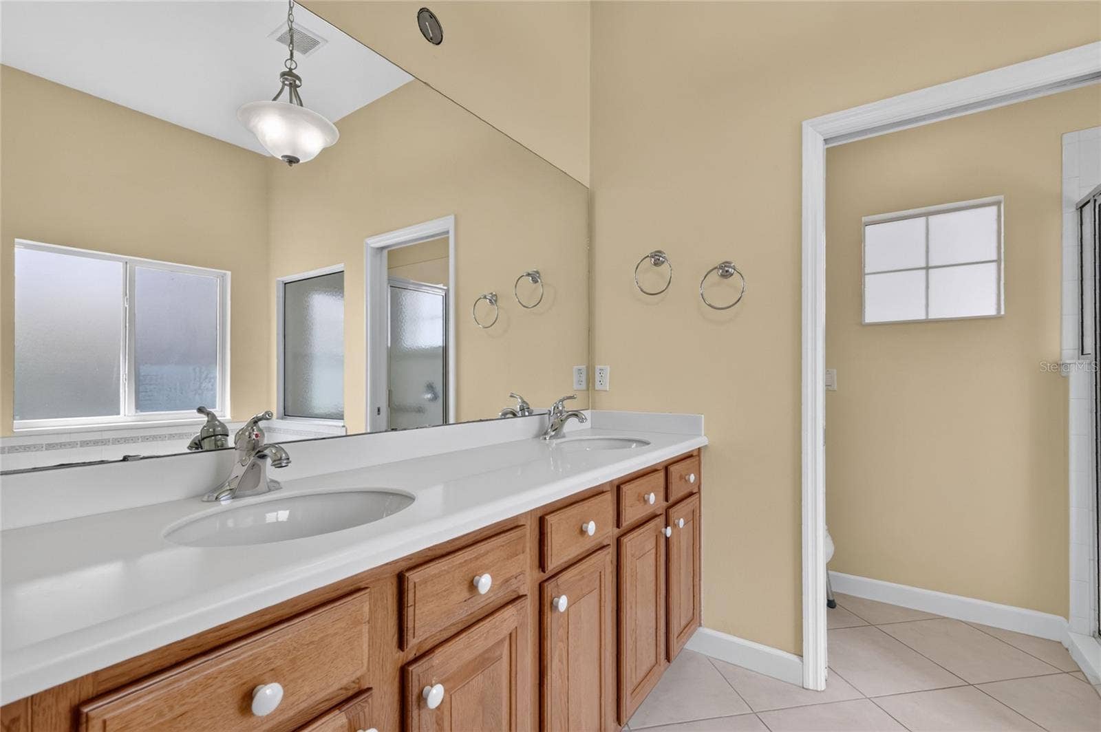 The oak cabinets and solid surface countertops provide lots of storage and space.