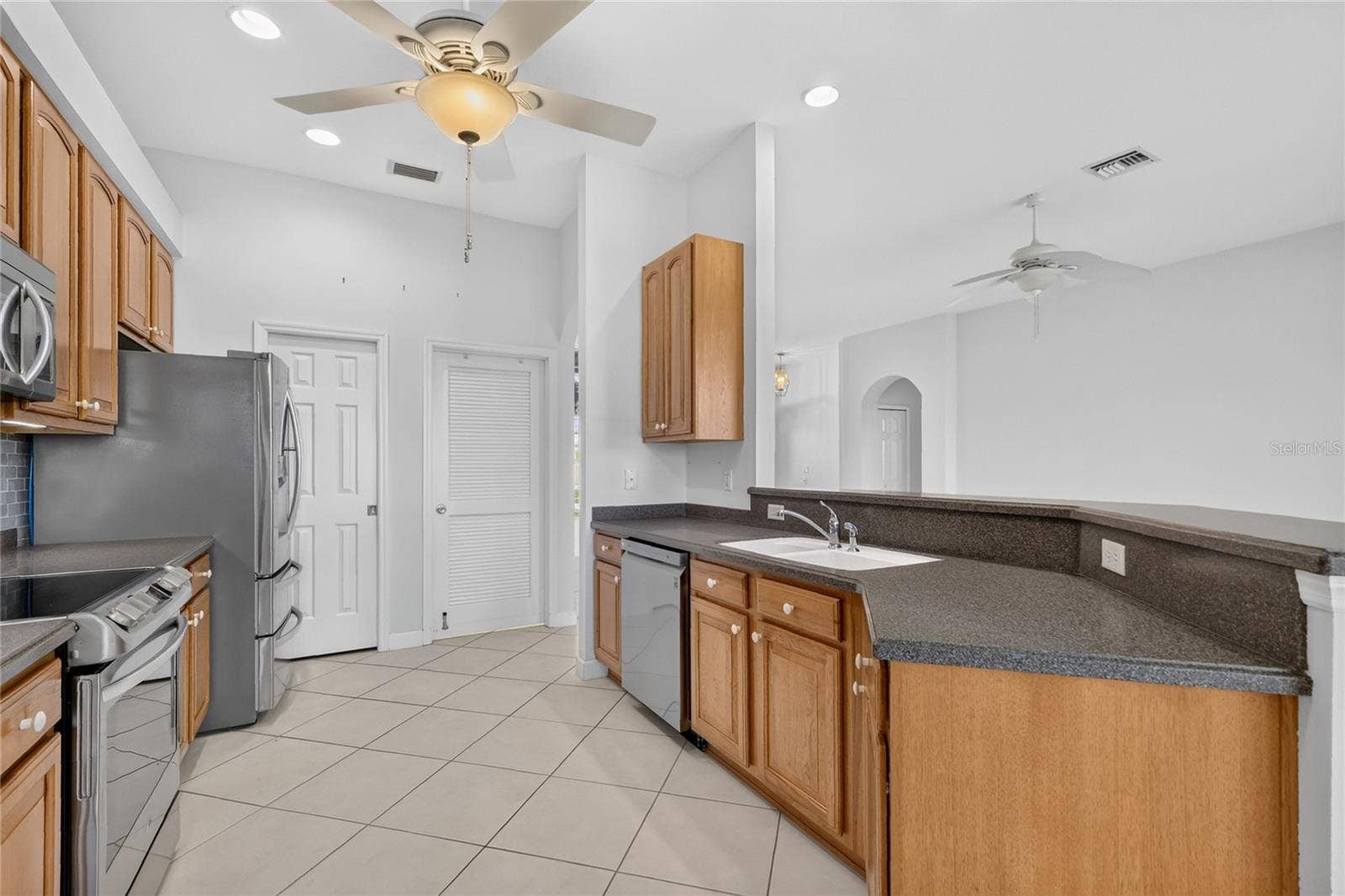 The laundry and pantry are located at the end of the kitchen.