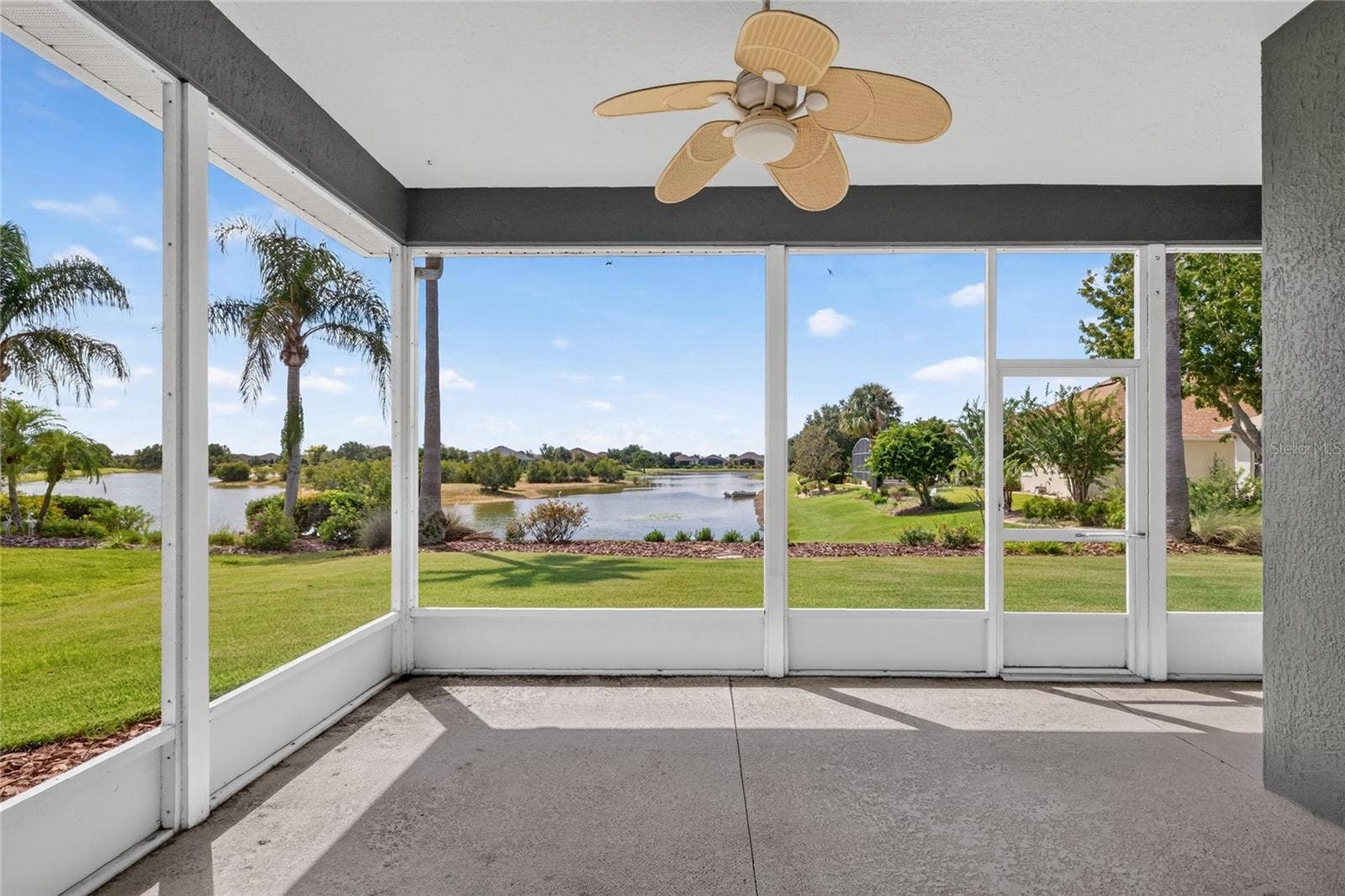 The screen lanai is a great place to catch a breeze off the lake, relax or entertain.