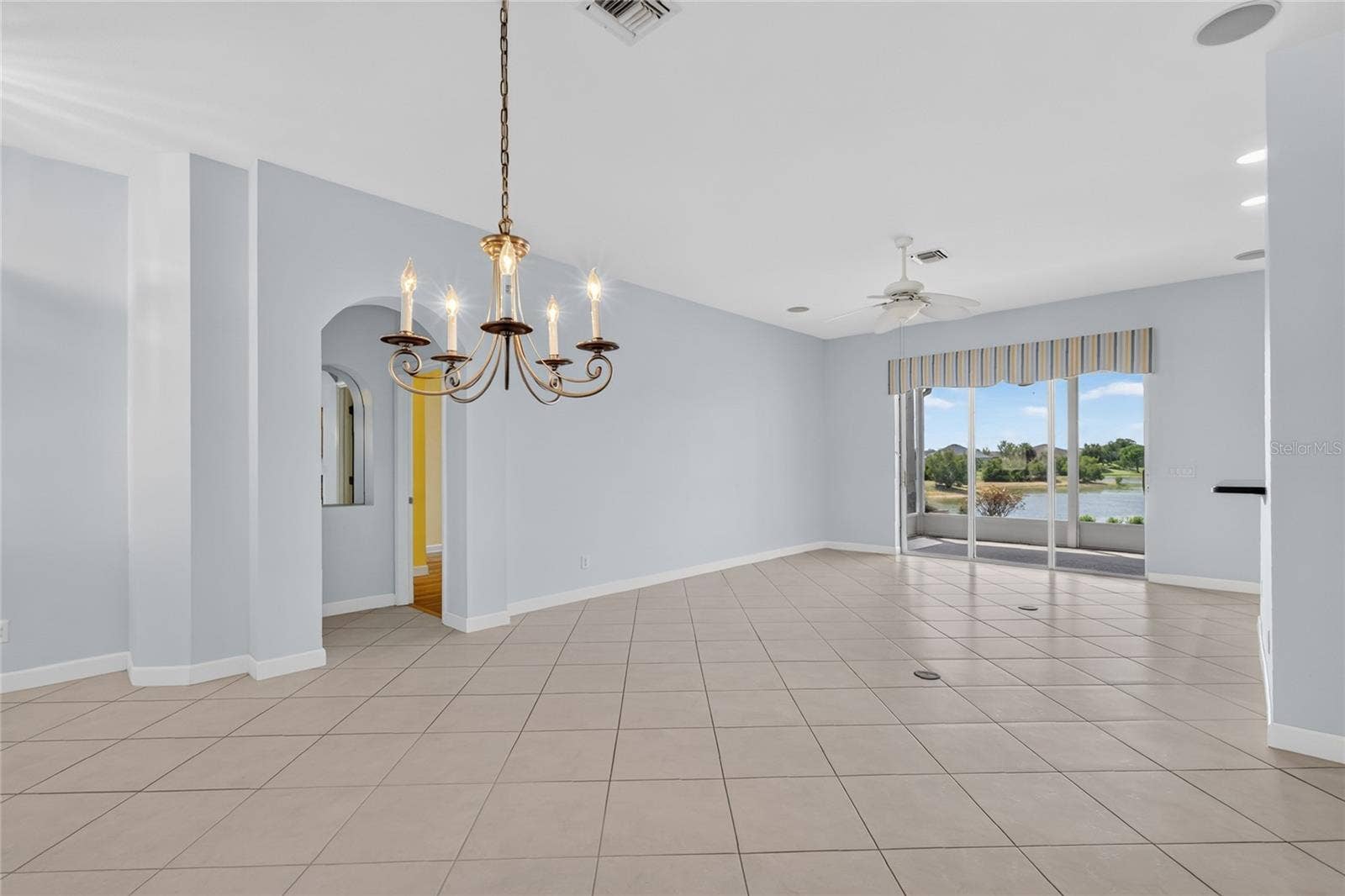 The Open Concept Floor Plan, with dining room, living room and kitchen allows views of the lake from all the rooms.