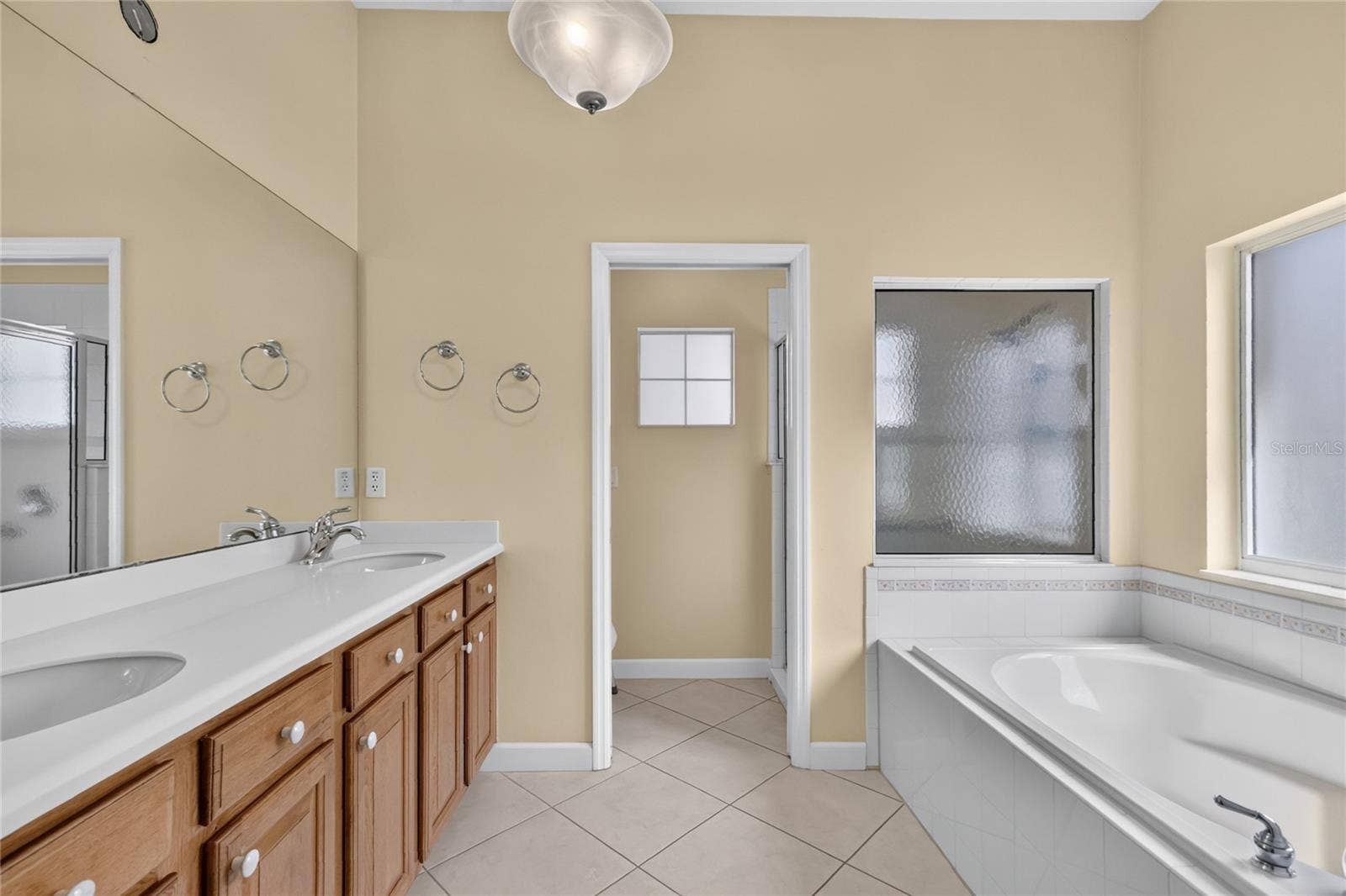 The ensuite bath has lots of storage, double sinks, a spacious tub and separate shower.