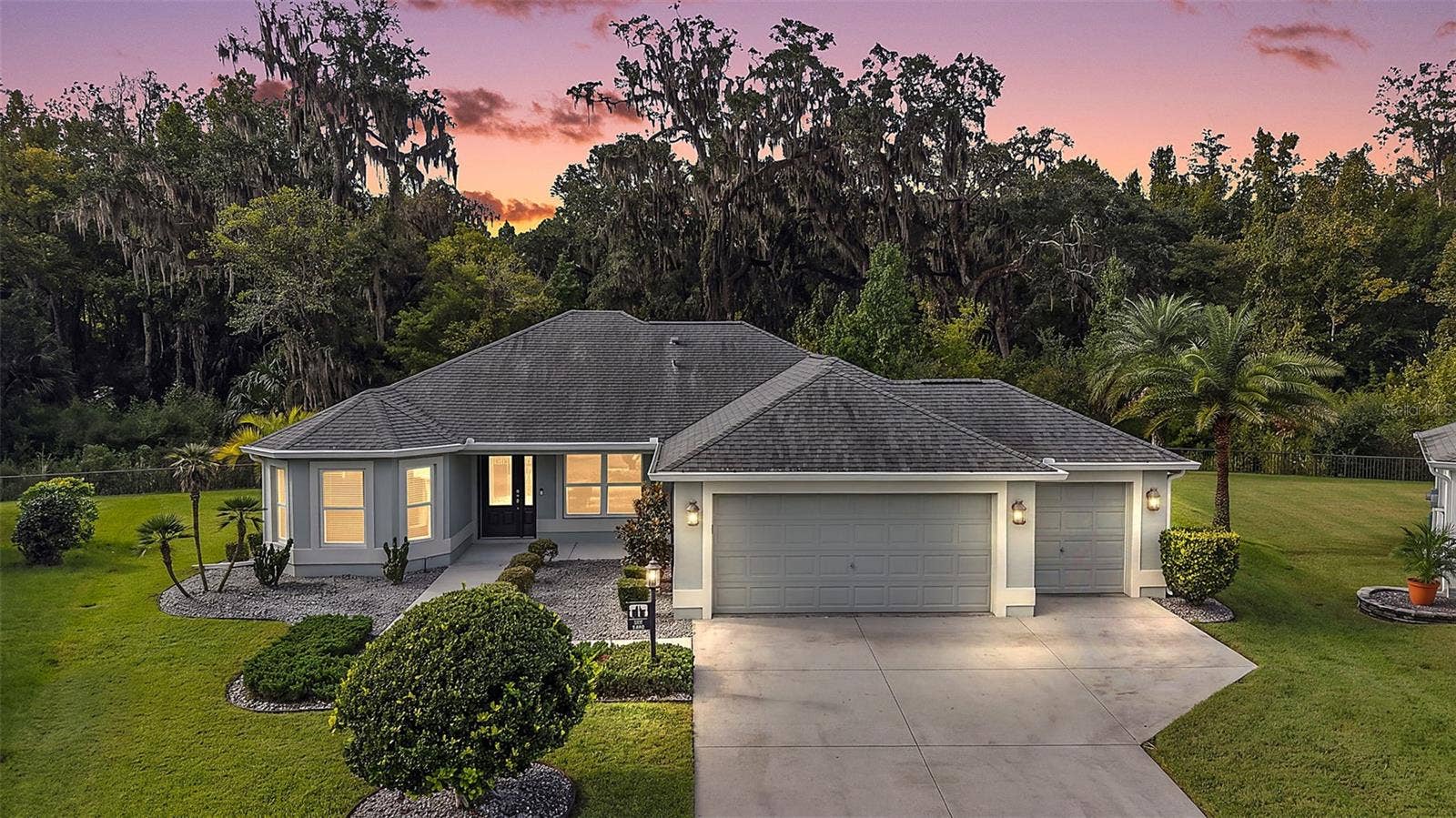 3254 ZIPPERER WAY, The Villages, FL 32163 Twilight Front Elevation with PRIVATE Preserve Views