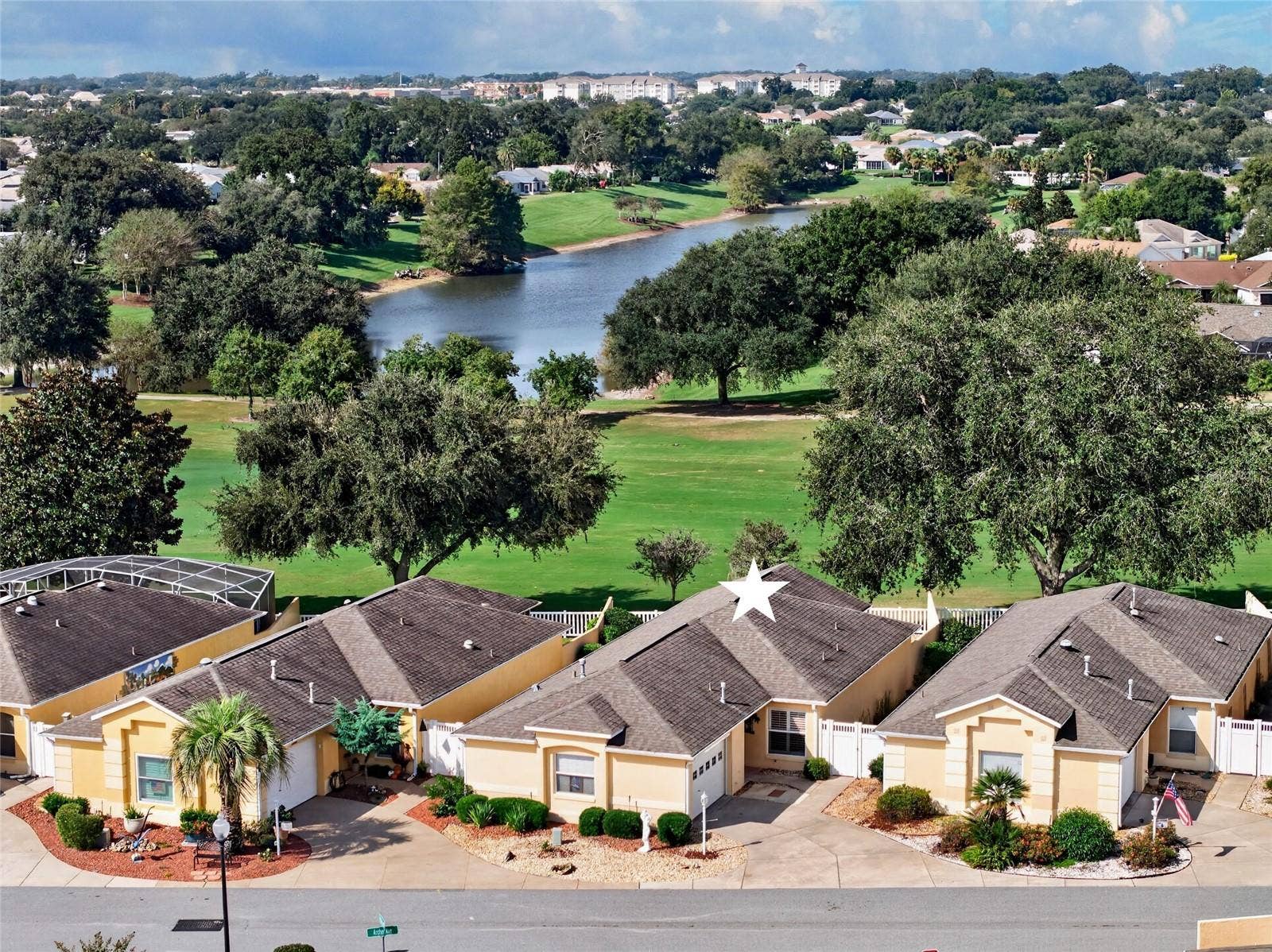 Front with view of lake and golf course