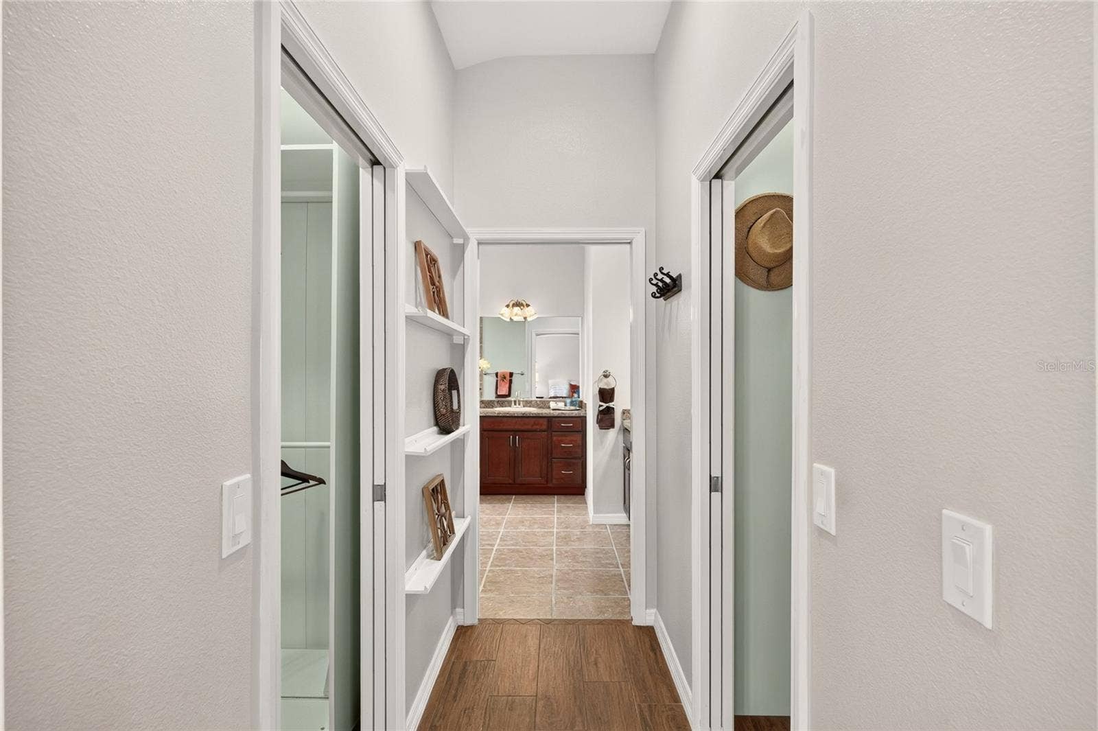 2454 MORNING DOVE LANE, The Villages, FL 32162 The GUEST WING features a convenient LINEN CLOSET and nearby guest bath, creating a comfortable space for visiting family and friends.