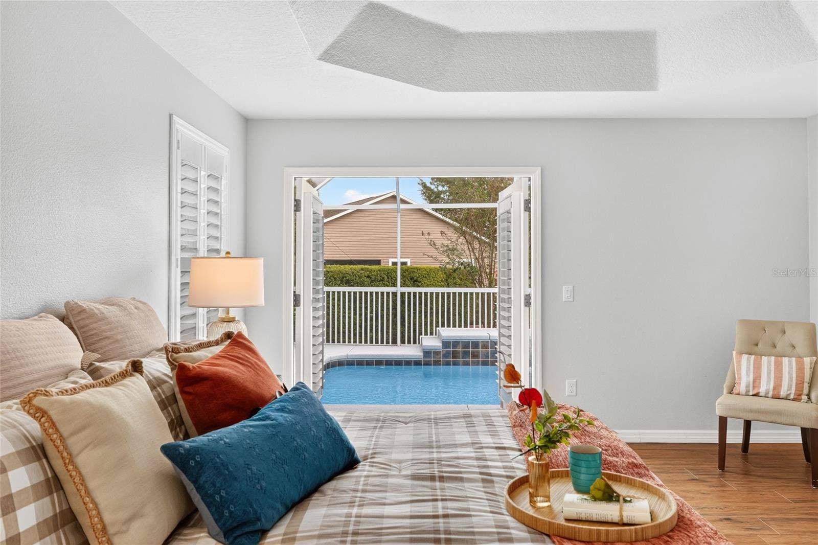 2454 MORNING DOVE LANE, The Villages, FL 32162 Wake up to sparkling POOL VIEWS and step through the PRIMARY SUITES French doors for a refreshing morning dip in your own backyard retreat!