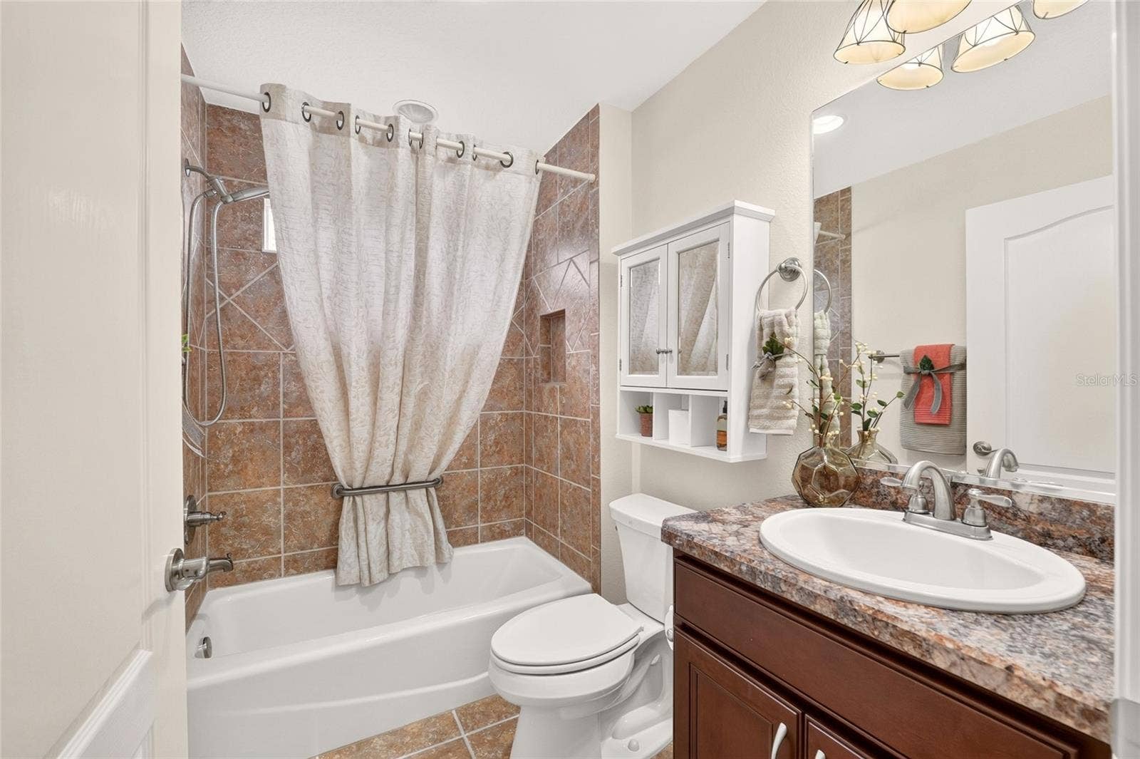 2454 MORNING DOVE LANE, The Villages, FL 32162 Guest bathroom with gorgeous natural light.