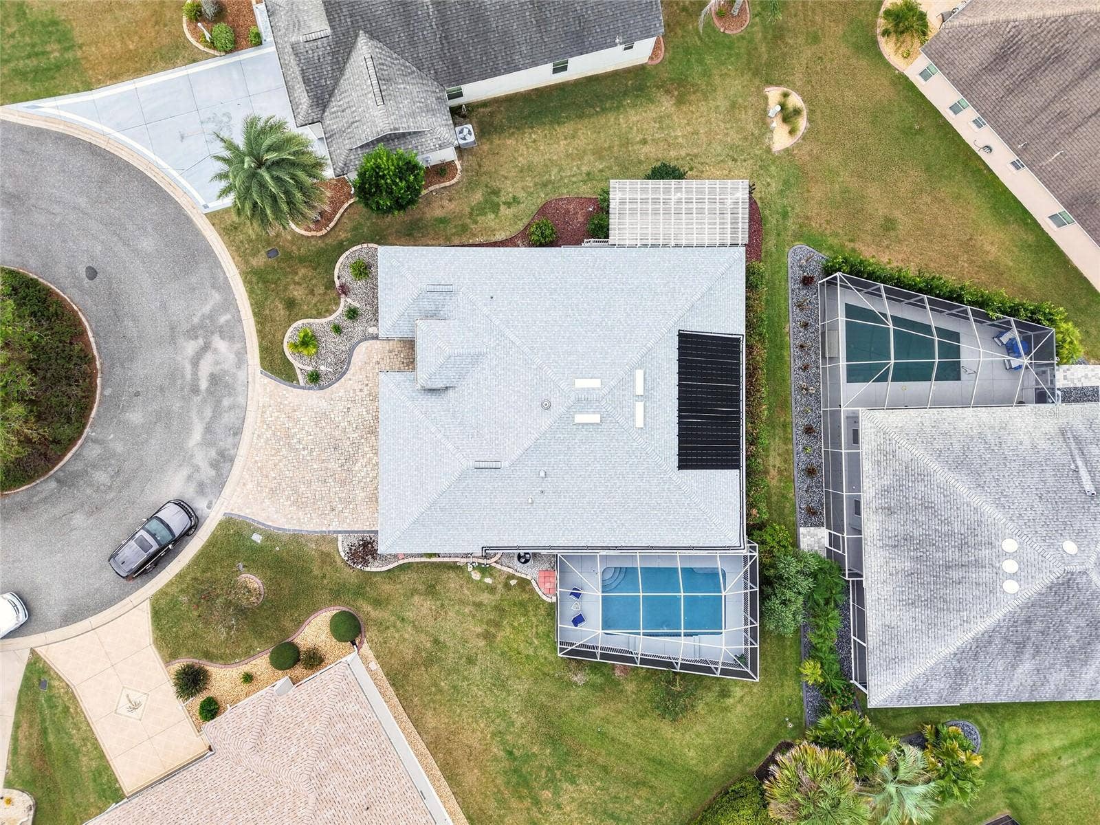 2454 MORNING DOVE LANE, The Villages, FL 32162 Nestled on a CUL-DE-SAC, this inviting home pairs a beautiful PAVER DRIVEWAY with a SCREENED POOL and generous outdoor space for relaxing and entertaining!