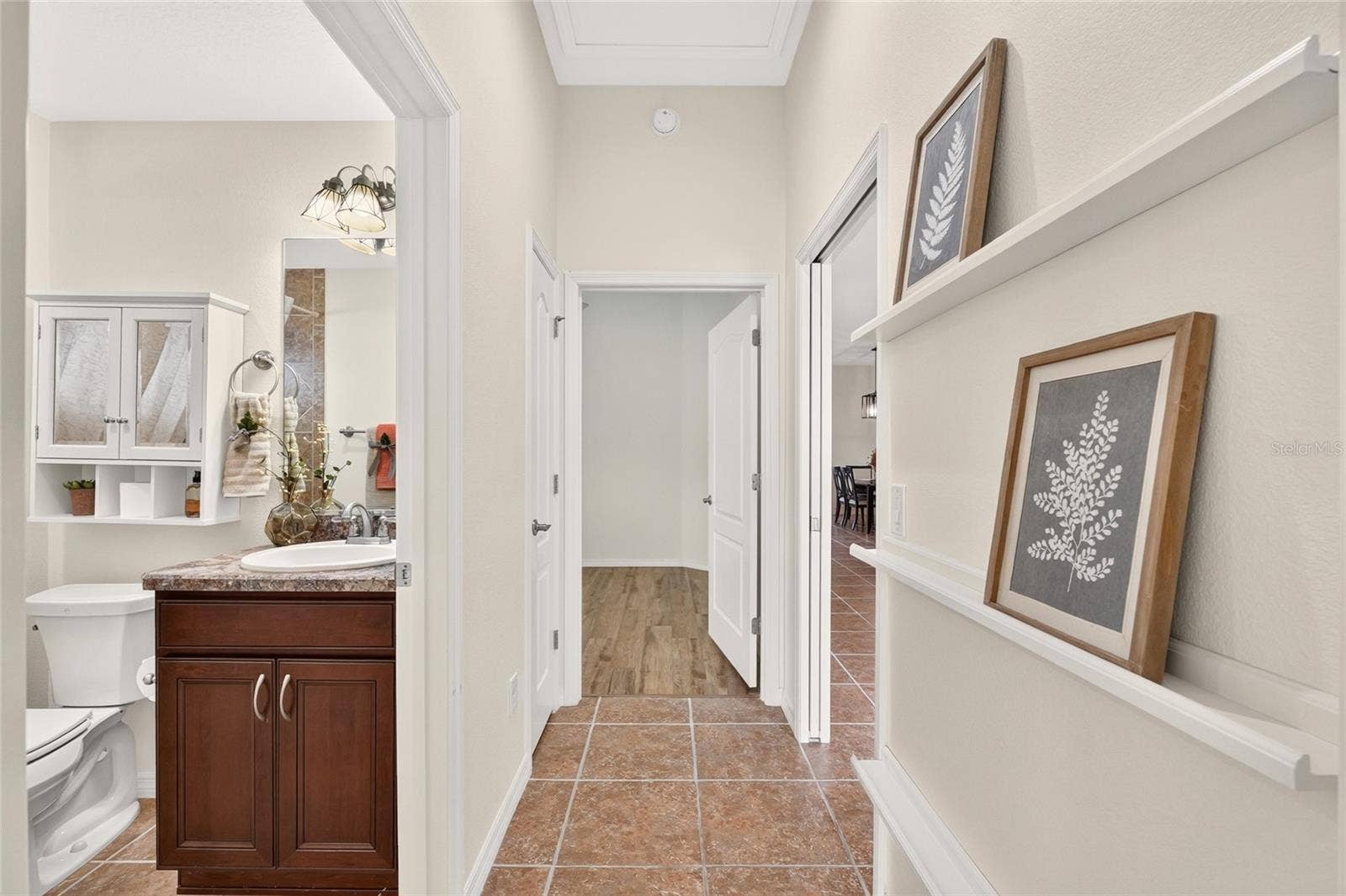 2454 MORNING DOVE LANE, The Villages, FL 32162 A pocket door separates the GUEST WING from the main living area, offering added privacy with convenient access to the guest bath.