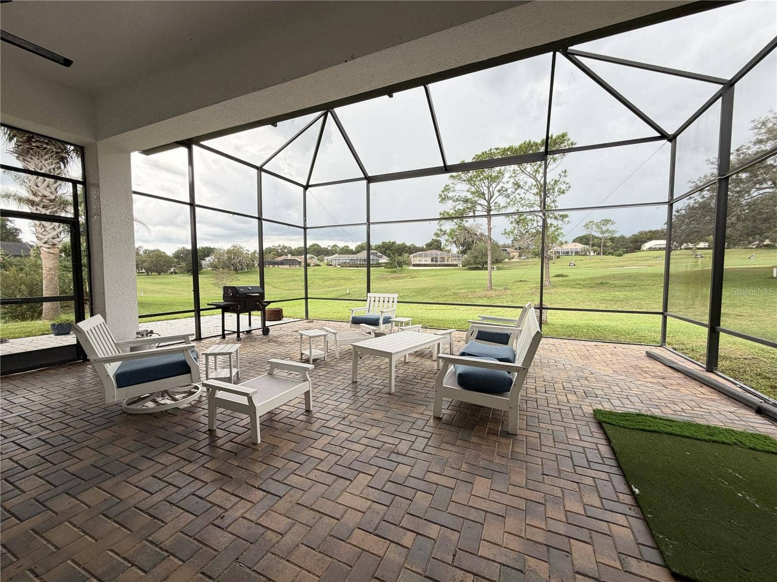 39539 HARBOR HILLS BOULEVARD, Lady Lake, FL 32159 Large screened lanai with brick pavers and golf-course views.