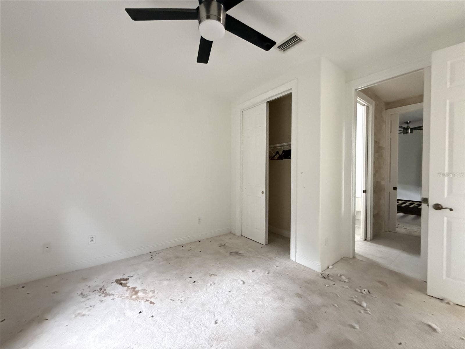 39539 HARBOR HILLS BOULEVARD, Lady Lake, FL 32159 Additional view of stained carpeting and debris in Bedroom 2.