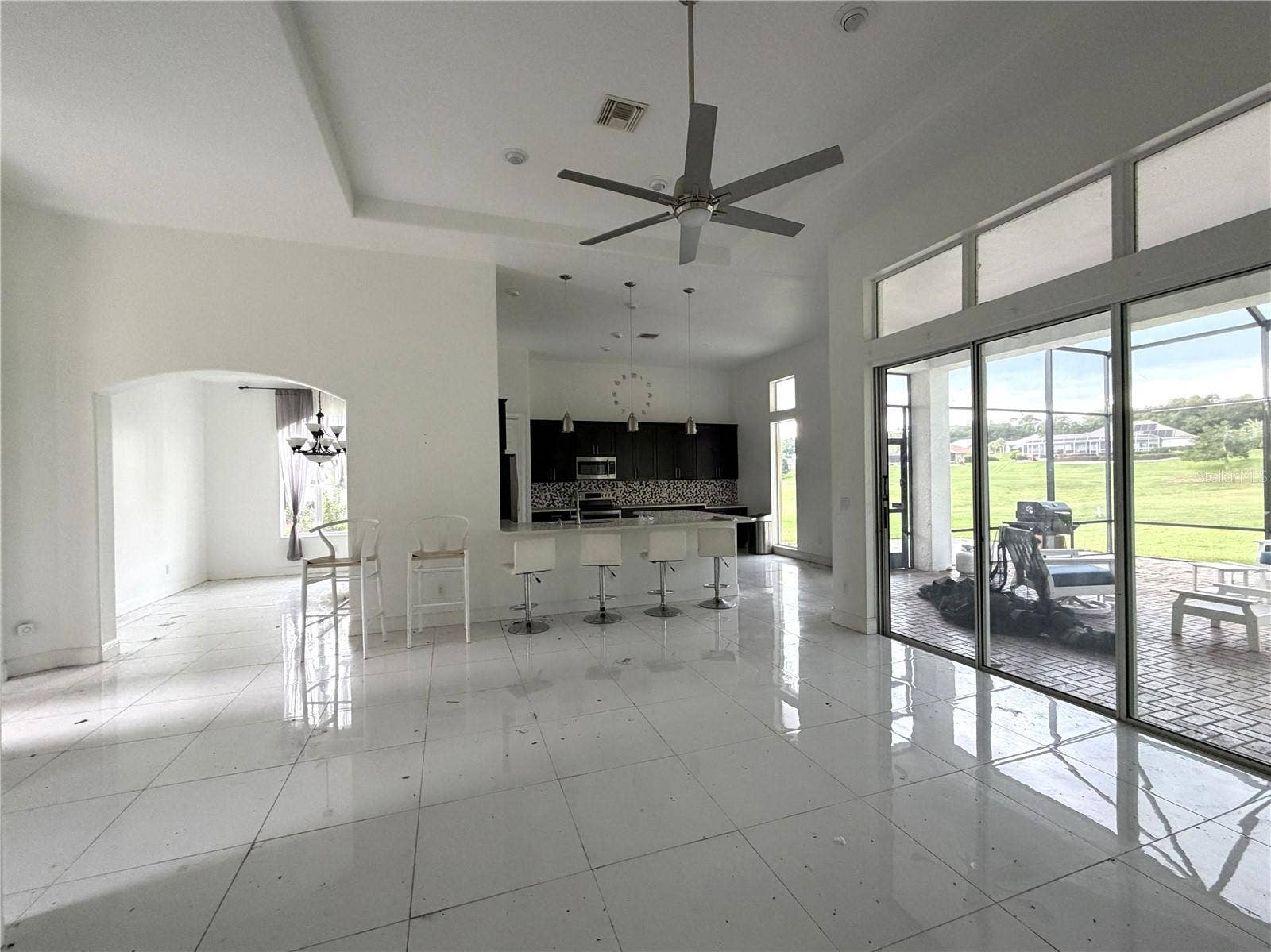 39539 HARBOR HILLS BOULEVARD, Lady Lake, FL 32159 Open great room connecting to kitchen, dining area, and rear lanai.