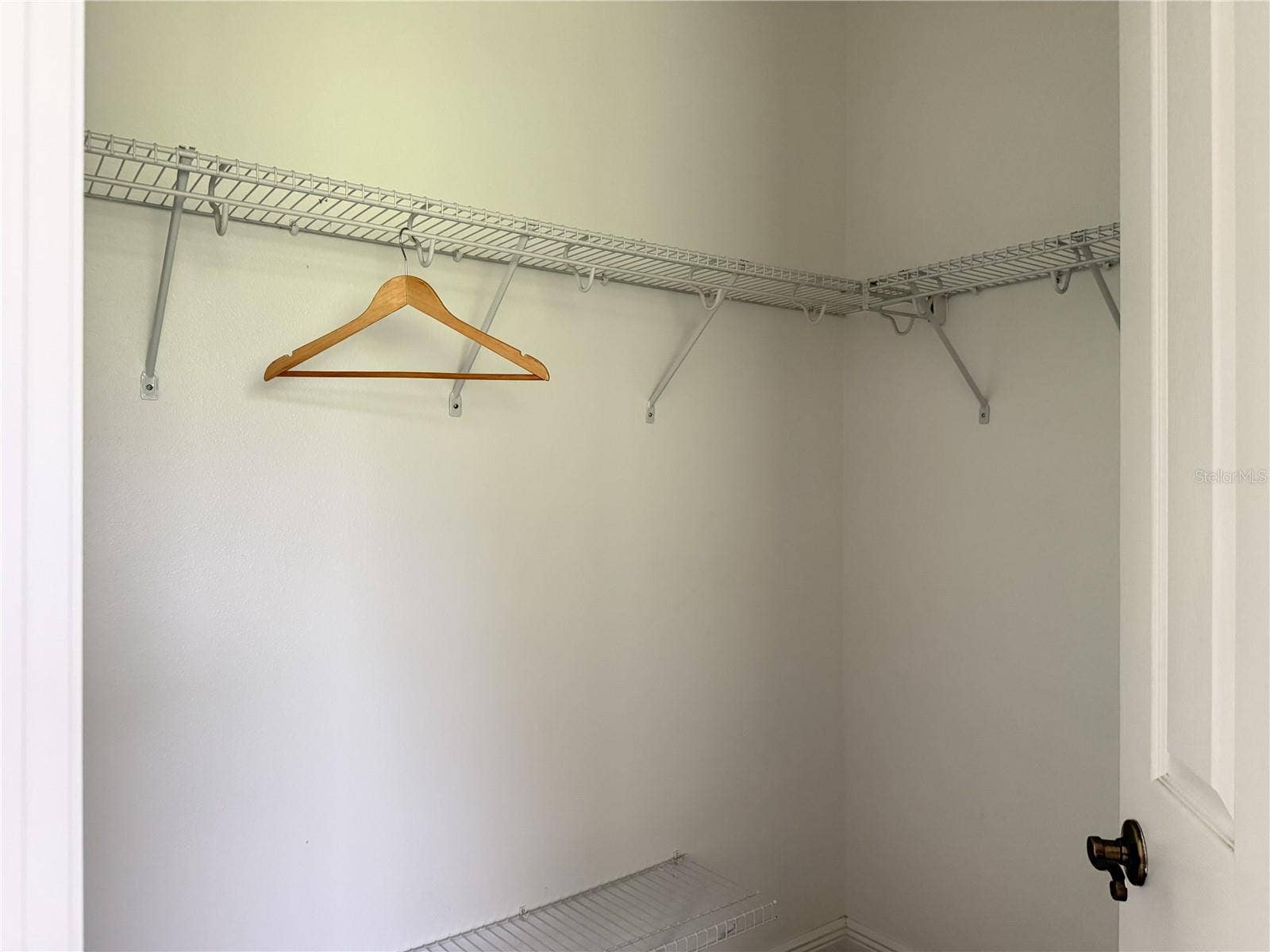 39539 HARBOR HILLS BOULEVARD, Lady Lake, FL 32159 Primary walk-in closet with wire shelving.