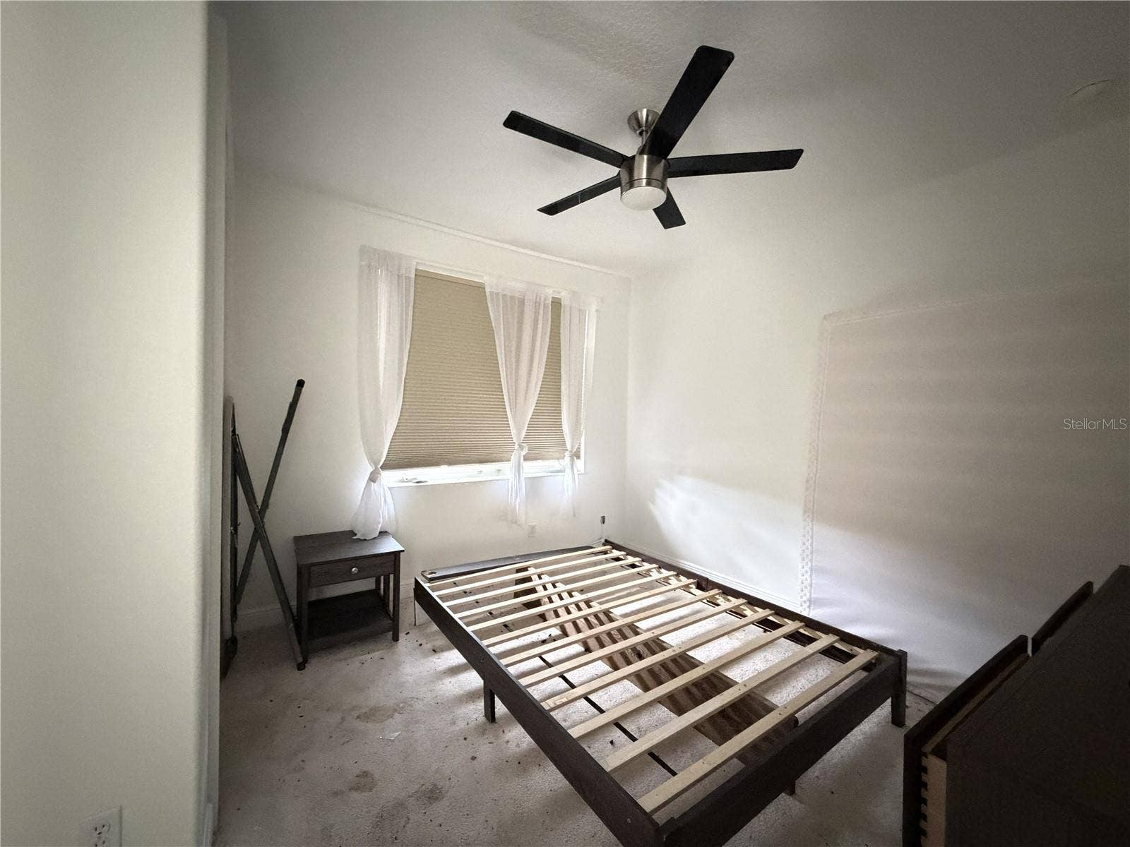 39539 HARBOR HILLS BOULEVARD, Lady Lake, FL 32159 Third bedroom with ceiling fan and exterior window; carpet shows soiling.