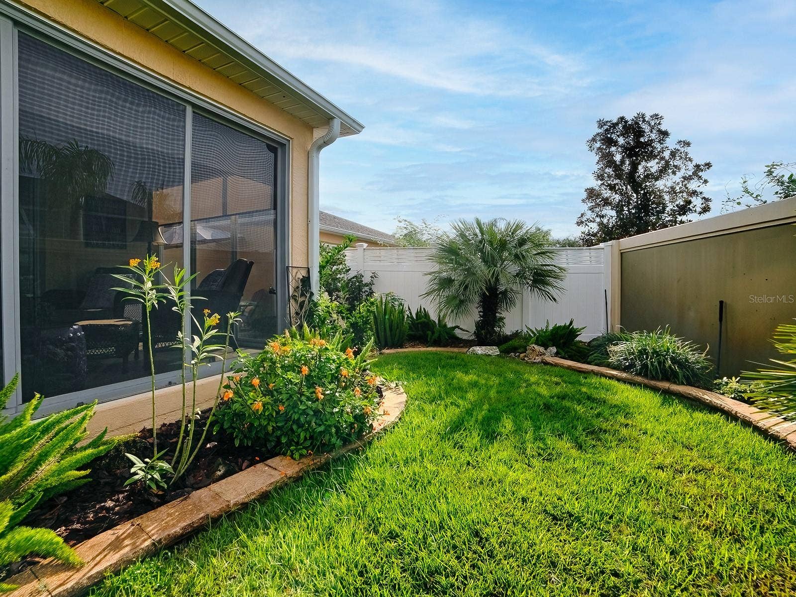 1530 BARNWELL PLACE, The Villages, FL 32162 And the rare, lush backyard continues throughout entire back space