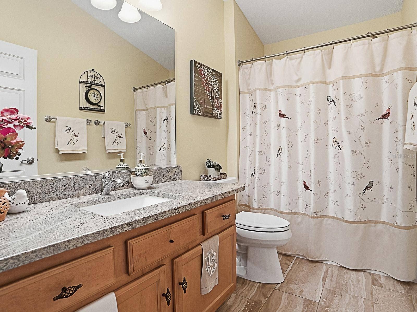 1530 BARNWELL PLACE, The Villages, FL 32162 Full guest bathroom with granite counter tops