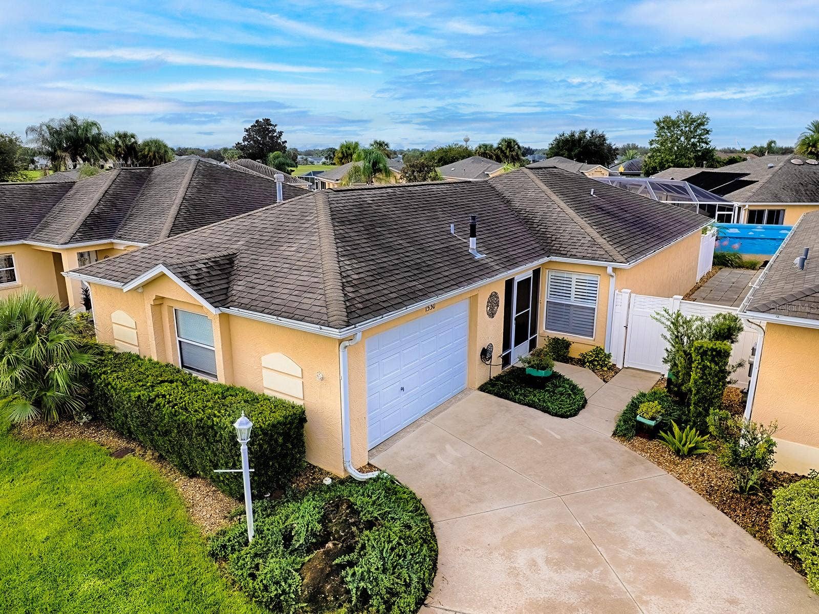 1530 BARNWELL PLACE, The Villages, FL 32162 Beautiful front yard with lush landscape