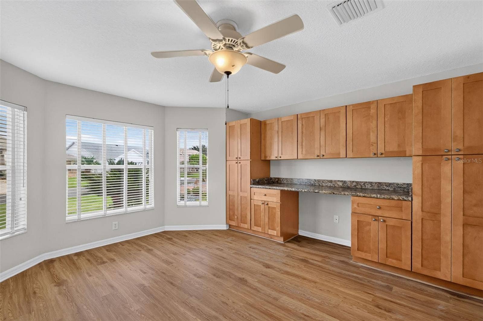 Second Bedroom with Custom Desk and Cabinetry