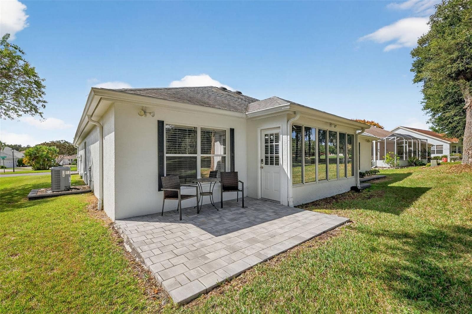 1201 BARCELONA DRIVE, The Villages, FL 32159 Rear Paver Patio Overlooking Golf Course