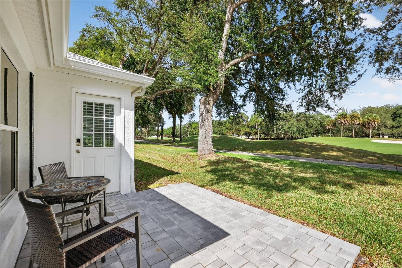 1201 BARCELONA DRIVE, The Villages, FL 32159 Rear Paver Patio Overlooking Golf Course