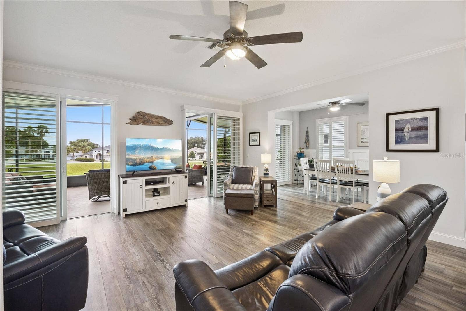 3210 SARATOGA DRIVE, Tavares, FL 32778 A $26K upgrade added three Andersen sliding glass doors, bringing in natural light and connecting indoor and outdoor living